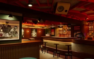 A dimly lit retro bar with a long wooden counter, round stools, and framed artwork on the walls.