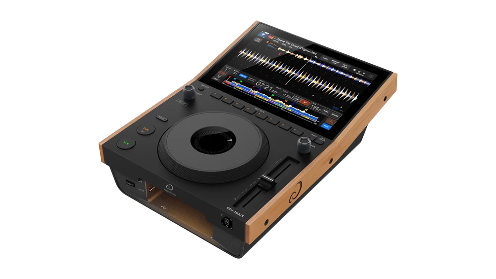 All-in-one DJ controller with a large jog wheel, touchscreen display, and wooden side panels.